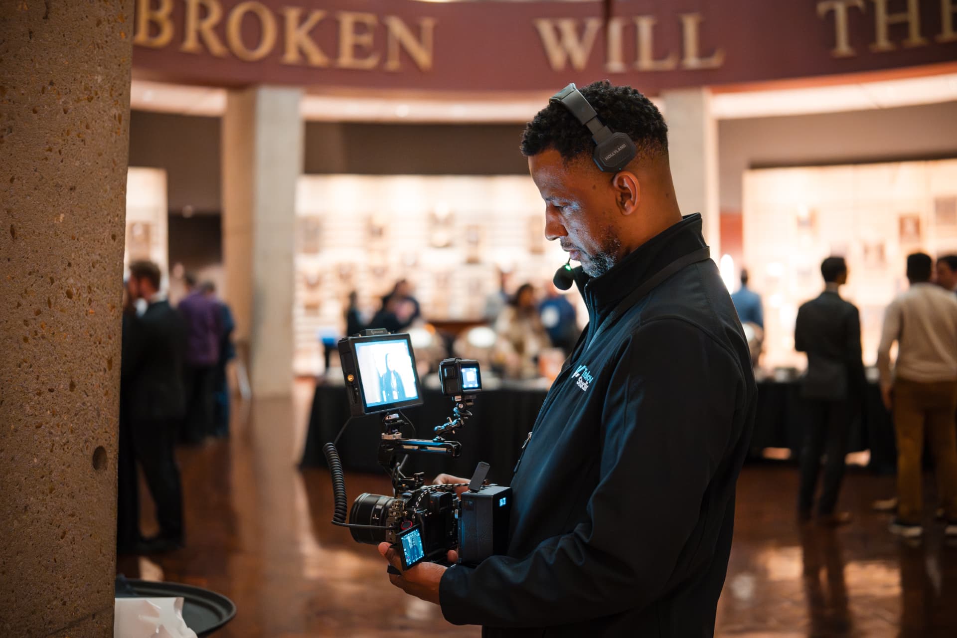 Jerrell Trulove operating a cinema camera rig at a corporate event